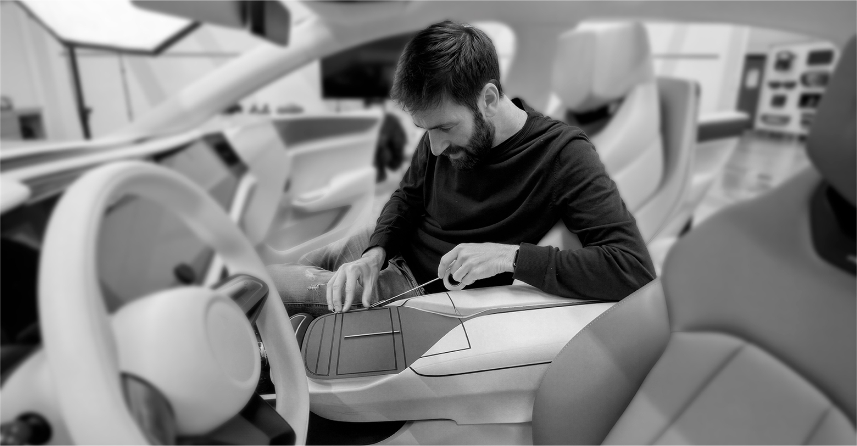 Full-scale prototyping — designer working on clay model interior