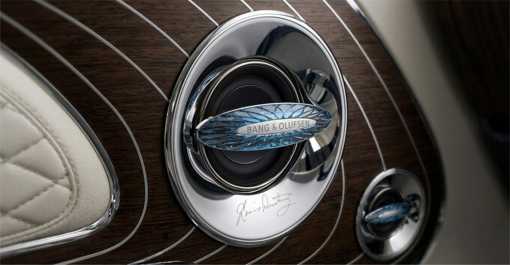 Speaker close-up — Bang & Olufsen branding with crystal detail